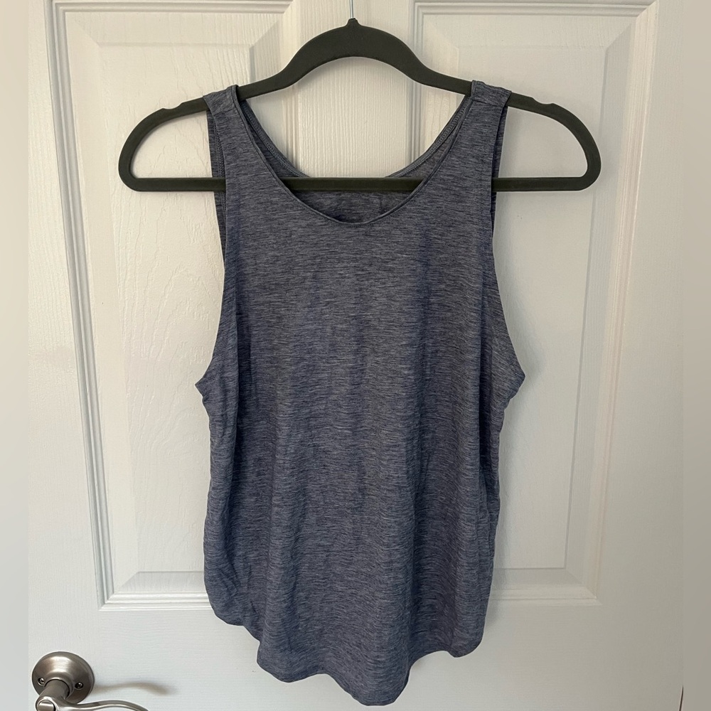 Athletic slight open-backed tank top from Under Armour.